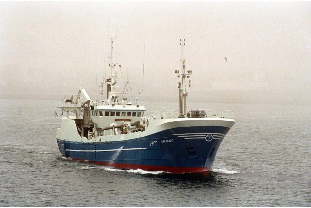 Large blue and white Pelagic trawler Challenge FR77 in the infamous Peterhead mist