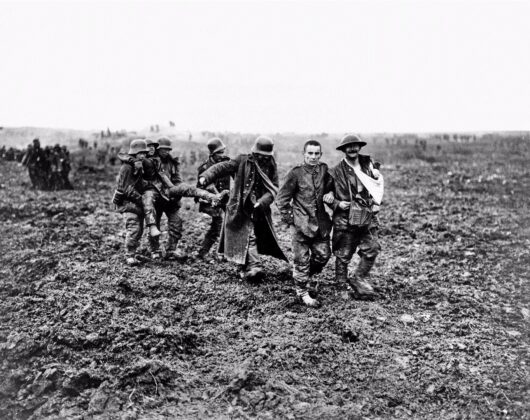 german_prisoners_of_war_help_the_canadian_wounded_to_the_dressing_station.jpg